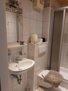 A bathroom at Apartment House Seerose