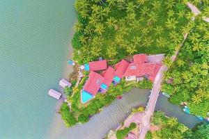 an aerial view of a house on an island in the water at Waterland in Negombo
