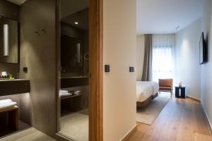 Łóżko lub łóżka w pokoju w obiekcie Hotel Arbaso