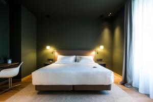 Łóżko lub łóżka w pokoju w obiekcie Hotel Arbaso