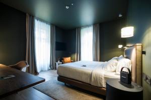 Łóżko lub łóżka w pokoju w obiekcie Hotel Arbaso