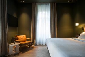 Łóżko lub łóżka w pokoju w obiekcie Hotel Arbaso