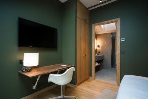 Telewizja i/lub zestaw kina domowego w obiekcie Hotel Arbaso