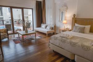 Кровать или кровати в номере Cocos The Club Solto