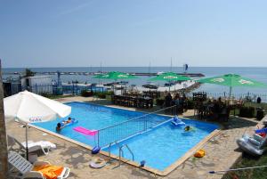 a large swimming pool with people in the water at Top Complex in Sveti Vlas