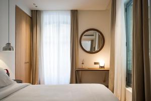 Łóżko lub łóżka w pokoju w obiekcie Hotel Arbaso