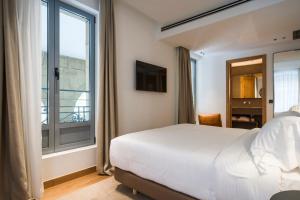Posteľ alebo postele v izbe v ubytovaní Hotel Arbaso