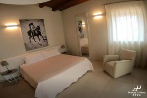 Postel nebo postele na pokoji v ubytování Domus Hyblaea Resort
