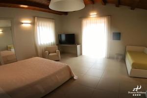 TV a/nebo společenská místnost v ubytování Domus Hyblaea Resort