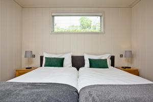 Postel nebo postele na pokoji v ubytování The Sleights, Strawberryfield Park