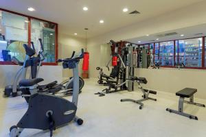 a gym with several treadmills and exercise bikes at Miarosa İncekum Beach in Avsallar