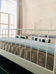 Postel nebo postele na pokoji v ubytování ZI' MARI' - Via Roma