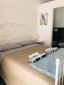 Postel nebo postele na pokoji v ubytování ZI' MARI' - Via Roma