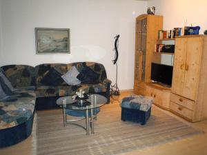 a living room with a couch and a table at Ferienwohnung Ilka Plank in Füssen