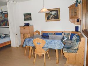 a dining room with a table and chairs in a room at Ferienwohnung Ilka Plank in Füssen +5 photos