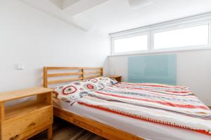Postel nebo postele na pokoji v ubytování Boží Apartments by Mountain ways