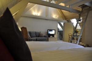 Postel nebo postele na pokoji v ubytování B&B 't Huys van Enaeme