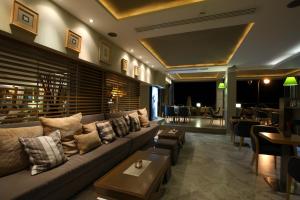 a living room with a couch and a table at Golden Star City Resort in Perea