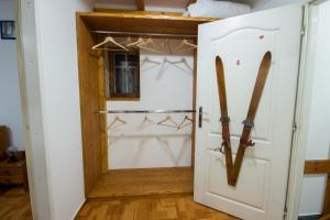 a room with a door with skis in it at Modrý pension in Rokytnice nad Jizerou