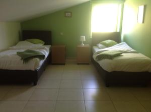 מיטה או מיטות בחדר ב-Holiday Home Koolhof