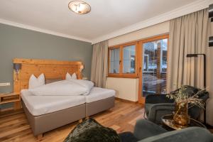Postel nebo postele na pokoji v ubytování Hotel Garni Berghof