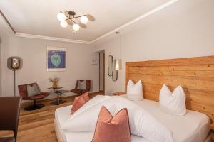 מיטה או מיטות בחדר ב-Hotel Garni Berghof