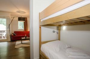 سرير بطابقين أو أسرّة بطابقين في غرفة في Résidence Rivière