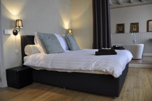 Postel nebo postele na pokoji v ubytování B&B 't Huys van Enaeme