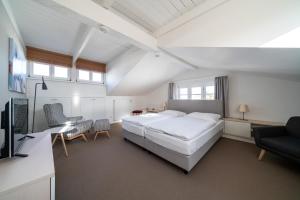 En eller flere senge i et værelse på Haus Heidelberg