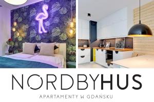 グダニスクにあるNORDBYHUS Apartamenty Chmielna Parkのピンクのフラミンゴの壁紙を使用したベッドルーム1室、キッチン、