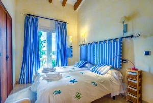 Giường trong phòng chung tại Villa Calvario