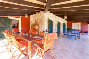 a dining room with a ping pong table and chairs at Villa Aumadrava Gran by Sealand Villas in El Port