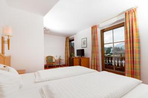 Bruggerhof - Camping, Restaurant, Hotel客房内的一张或多张床位