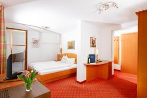 Bruggerhof - Camping, Restaurant, Hotel客房内的一张或多张床位