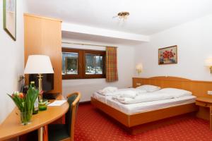 Bruggerhof - Camping, Restaurant, Hotel客房内的一张或多张床位