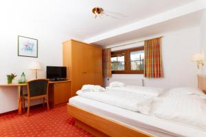 Bruggerhof - Camping, Restaurant, Hotel客房内的一张或多张床位