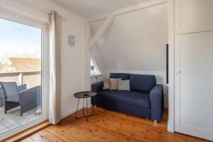 Posezení v ubytování Ferienwohnung BROMBEERE mit großem Garten und Balkon