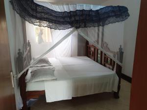 Postel nebo postele na pokoji v ubytování Peponi Watamu