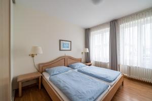 Ένα ή περισσότερα κρεβάτια σε δωμάτιο στο Haus Sonnenschein Göhren