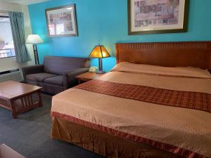 Letto o letti in una camera di Claridge Inn - St. George