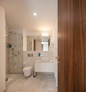 a bathroom with a toilet and a sink and a shower at Lisbon Serviced Apartments - Avenida in Lisbon