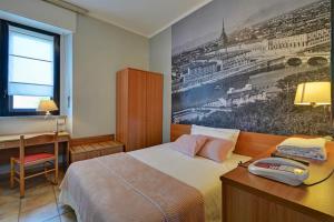 Postel nebo postele na pokoji v ubytování Astor Hotel