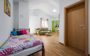 Postel nebo postele na pokoji v ubytování Apartments Nelle