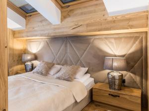 Postel nebo postele na pokoji v ubytování POD SKOCZNIA SPA Zakopane