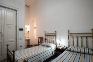 Postelja oz. postelje v sobi nastanitve Hotel AeR BJ Vittoria