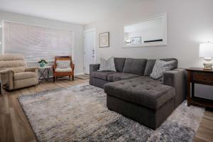 a living room with a couch and a chair at Walnut Bungalow East in Hillsboro