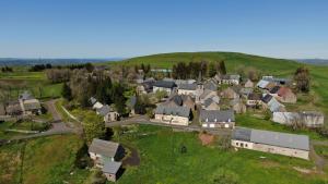an aerial view of a small town with houses at Auberge du Cezallier in Montgreleix