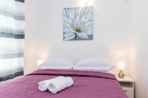 Postel nebo postele na pokoji v ubytování Apartmani Vesna
