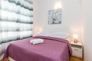 Postel nebo postele na pokoji v ubytování Apartmani Vesna