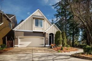 a house with a garage at Beaverton Creek Cottage in Beaverton